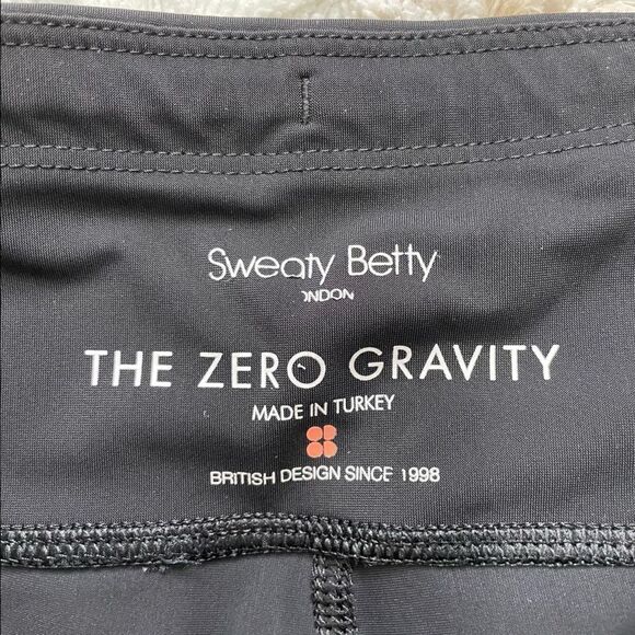 [s] [Short] Sweaty Betty Zero Gravity Full Length Legging Black w/Orange Zig Zag - Picture 11 of 11